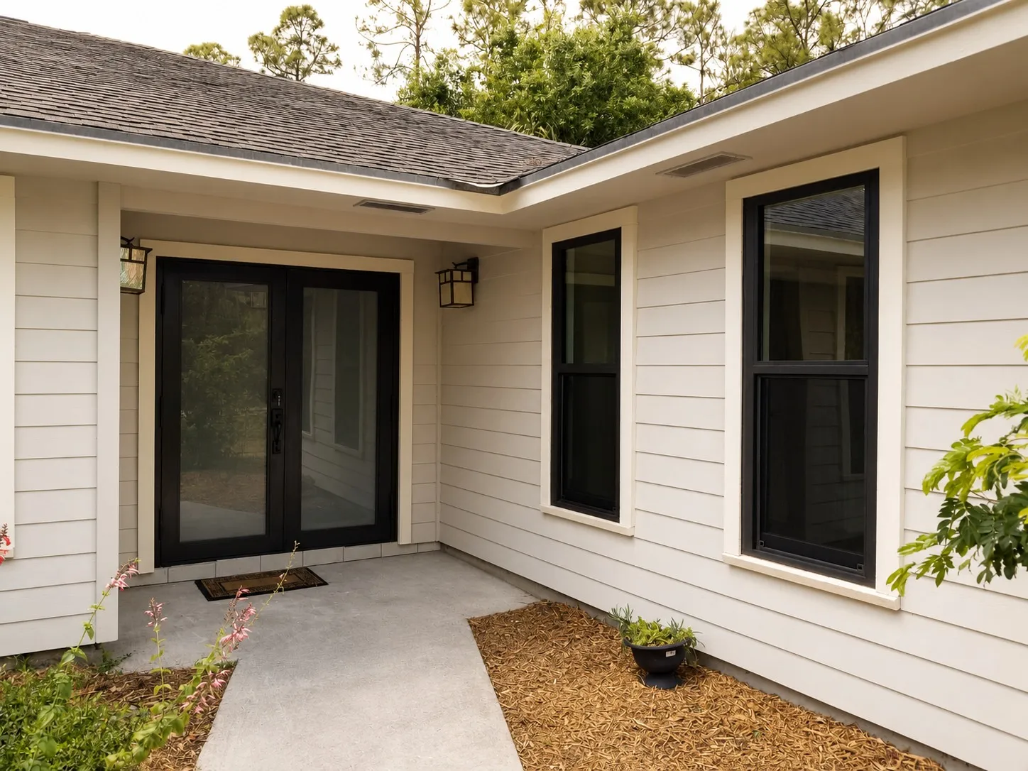 Impact windows supplied by MVC Windows & Doors, in place on a completed job